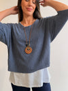 Buzo superpuesto con collar